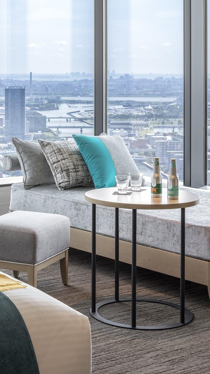 Luxury hotel room with a stunning city view, representing a premium stay experience earned through member points.